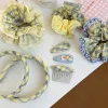 The new 2026 yellow and green checkered large intestine hair band exudes a sweet and elegant charm. It features a hair tie with elastic bands and a checkered hair tie Specification image